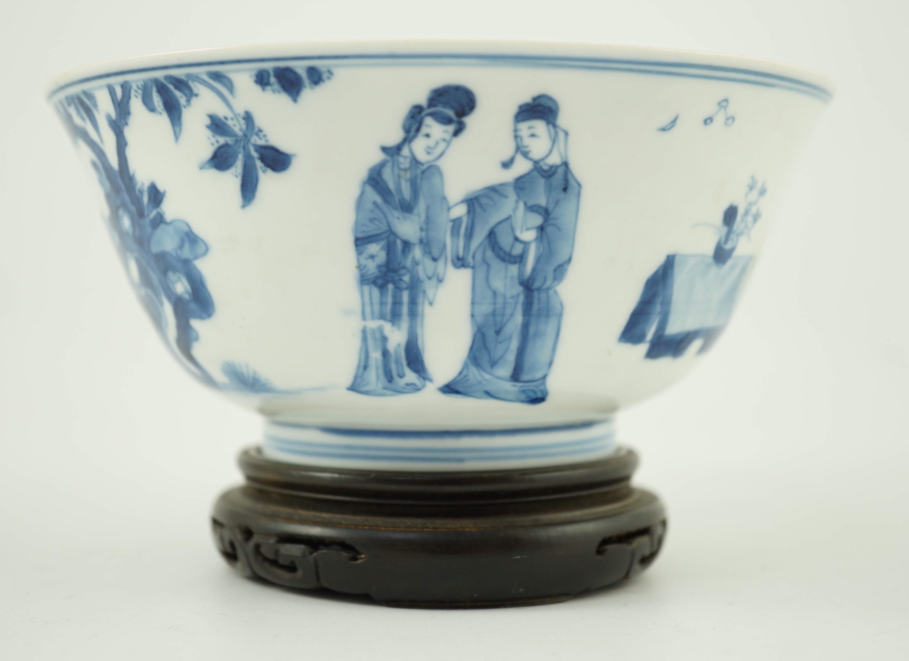 A Chinese blue and white ‘ladies’ bowl, Kangxi period, 15.5cm diameter, wood stand